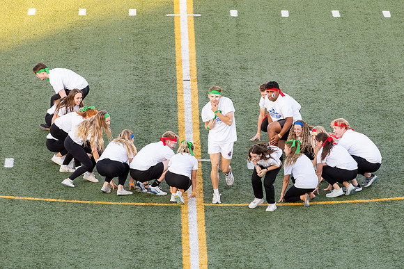 Students gather at the stadium to watch the football championship.