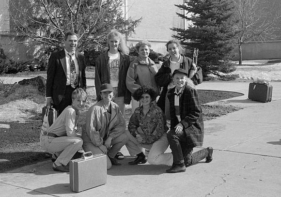 1993, Steven D Bennion, President of Ricks College stops to pose with Lori Woodland and some of her Women's Basketball players outside the Hart Building.