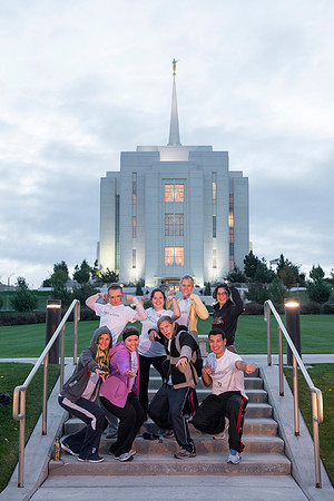 Team members pose by the Rexburg temple before they begin the temple to temple run