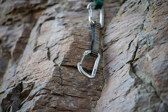 Detail shots of a carabiner. (Climbing wall up Kelly Canyon)
