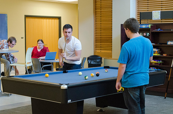 Students playing pool in the Manwaring Center