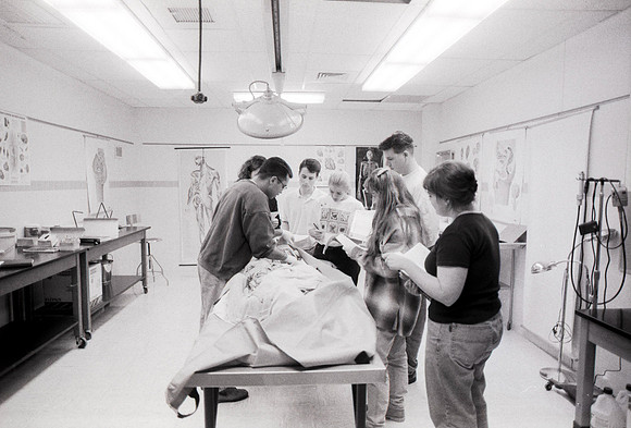 Biology students study on cadavers.