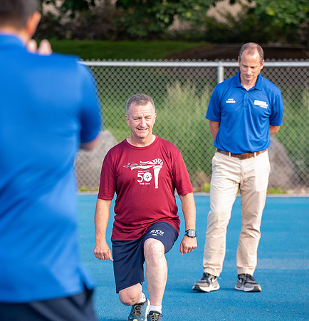 Faculty and community members of BYUI at Speed and Agility triathlete trannings at the stadium.