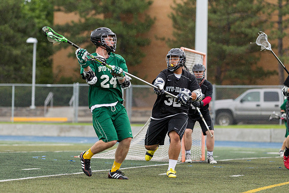 Spartan's Kevin Bosley (24) tests Knight's defender Daniel Calvillo, during Saturday's stormy game at the stadium.