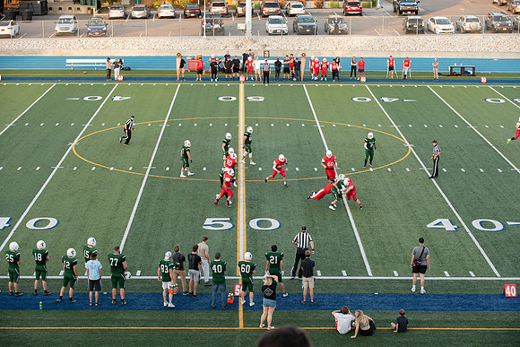 BYU-Idaho Football Teams compete in the Final Game of the Season. Students cheer them on from the stands, as the spirit team and Rix Stix Rally them up.