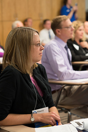 Faculty gather in the Hinckley Building at a Faculty Conference to share and learn from each other at the beginning of the 2013 Fall semester.