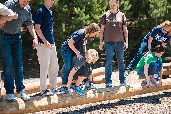 Online Instructors come to BYU-Idaho campus for further learning to enhance teaching skills. Instructors take their turn at the Ropes Course.