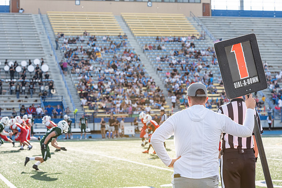 Students gather at the stadium to watch the football championship.