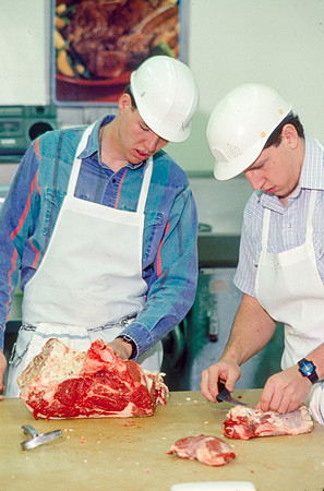 Students participate in a Meat Cutting Lab. February 1995.