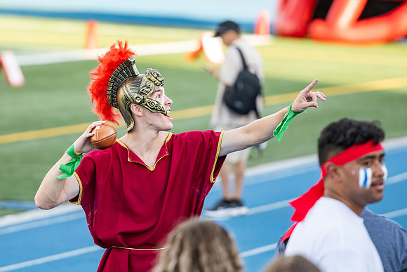 Students gather at the stadium to watch the football championship.