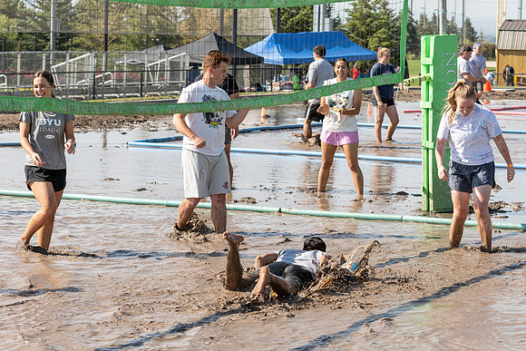 Students gather by the upper fields on the BYU-Idaho Campus to play recreation games, slip 'n' slide, mud volleyball, and try the ropes course.