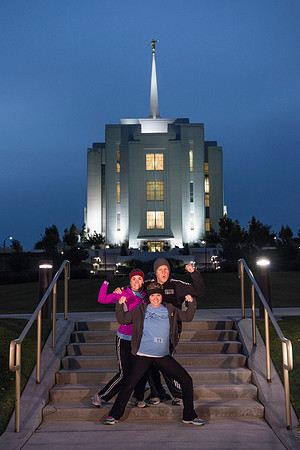 Team members pose by the Rexburg temple before they begin the temple to temple run