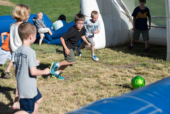 Faculty and their families, as part of the Online Learning & Teaching Conference, join together for dinner and games.