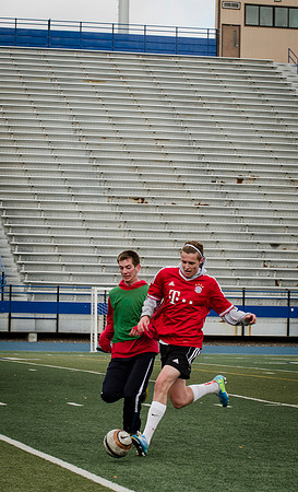 Students in Aimee Zimmer's Soccer class play outside in the Hart Stadium