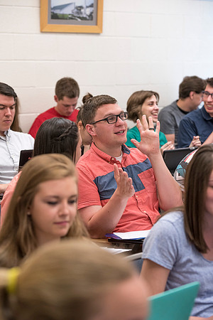 Students working with each other in the Foundations of the Restoration course on campus.