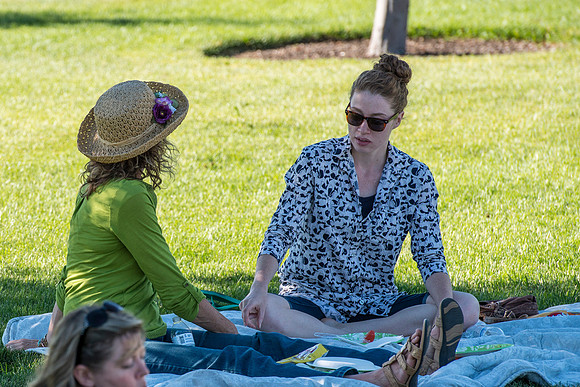 Faculty and their families, as part of the Online Learning & Teaching Conference, join together for dinner and games.
