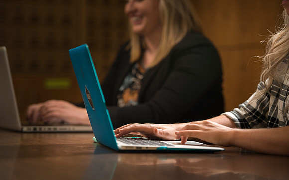 Katelyn Crompton and Rachael Redford study in the basement of the Smith Building.