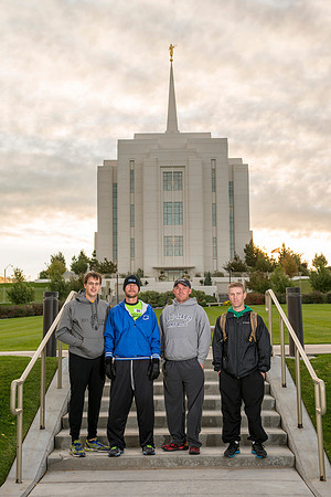 Team members pose by the Rexburg temple before they begin the temple to temple run