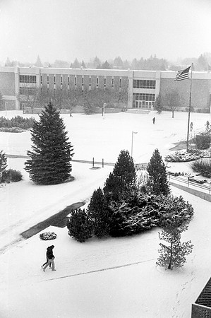 A view of the John L. Clarke Building on a snowy campus