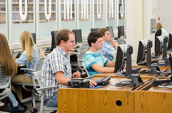 Hans Stokes &amp; other students studying in the Library