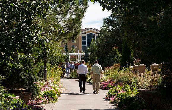 Faculty gather in the Hinckley Building at a Faculty Conference to share and learn from each other at the beginning of the 2013 Fall semester.