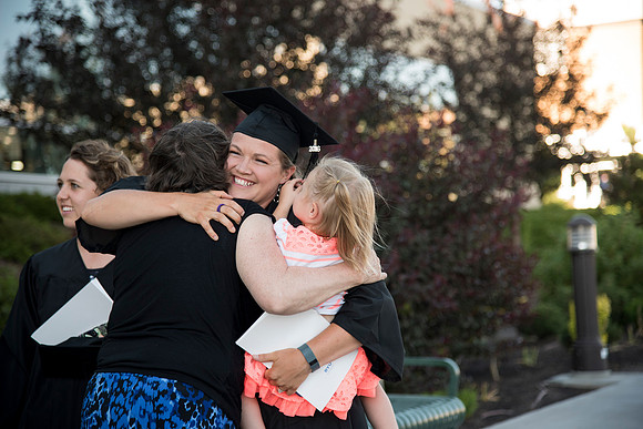 Graduates with their families on campus at BYU-Idaho prior to Convocation. Photo by Ryan Chase