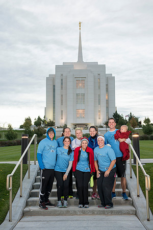 Team members pose by the Rexburg temple before they begin the temple to temple run