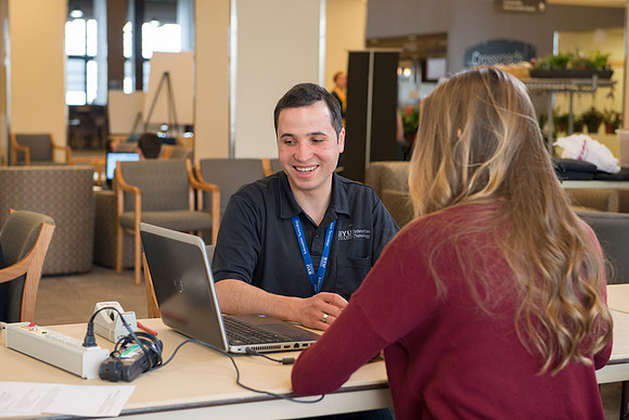 Taylor Nelson is helped by Marius Corca, a student employee from the IT Department.