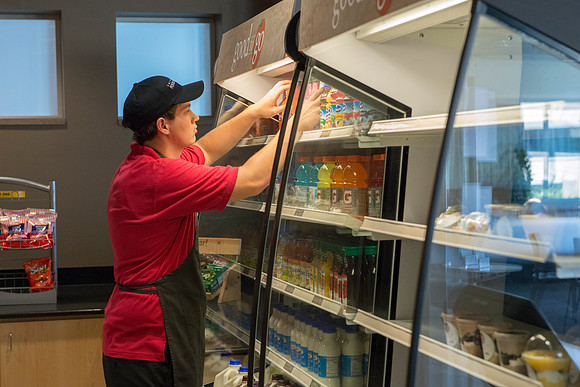 Stocking the shelves in the Good to Go section of the Crossroads Foodcourt.