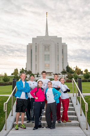 Team members pose by the Rexburg temple before they begin the temple to temple run
