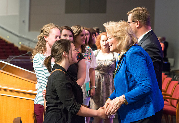 Sheri Dew speaks at devotional and gives out lots of hugs and greetings afterwards.