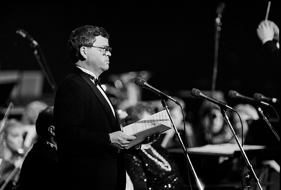 Sacred Music Series: Visions of Eternity. Soloist sings a piece for the performance. Performance held in the Hart Auditorium of Ricks College.