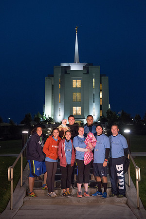 Team members pose by the Rexburg temple before they begin the temple to temple run
