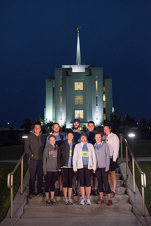 Team members pose by the Rexburg temple before they begin the temple to temple run