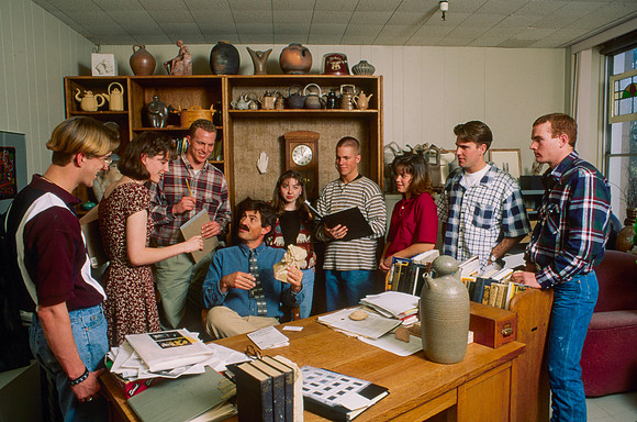 Art teacher, Matt Geddes, surrounded by his art students.