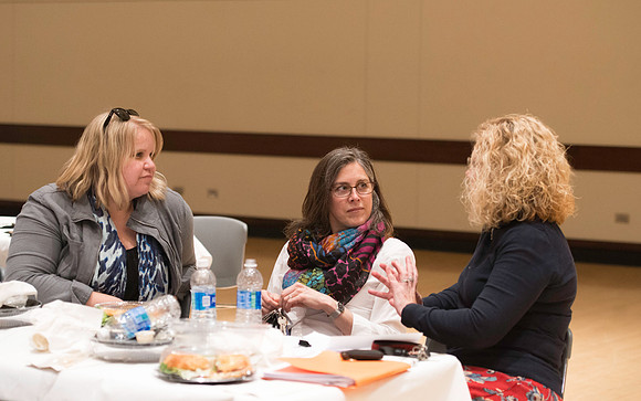 Faculty mingle after Dr. Maryellen Weimer addresses the faculty during a luncheon.