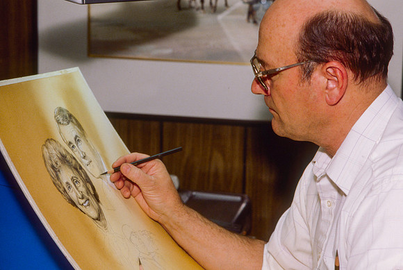 Graphic Artist, Dick Bird, works on an original piece. Illustration for President Joe J. Christensen.