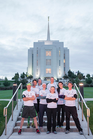 Team members pose by the Rexburg temple before they begin the temple to temple run