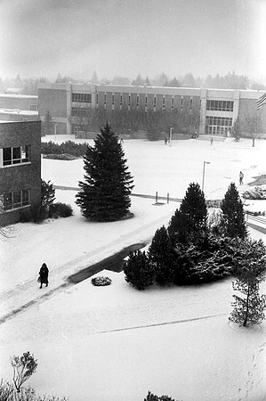 A view of the John L. Clarke Building on a snowy campus
