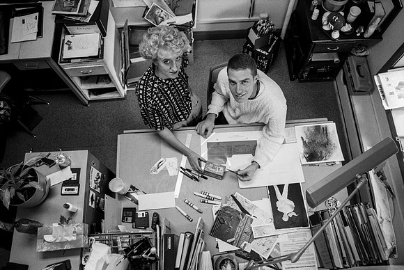 Graphic Design students, Dawn Franson and Gheen Hillman, work on a project together.