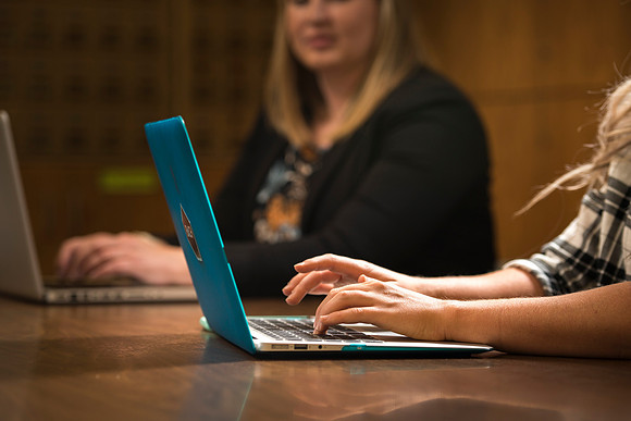 Katelyn Crompton and Rachael Redford study in the basement of the Smith Building.