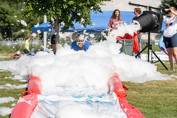 Students gather by the upper fields on the BYU-Idaho Campus to play recreation games, slip 'n' slide, mud volleyball, and try the ropes course.