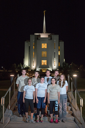Team members pose by the Rexburg temple before they begin the temple to temple run