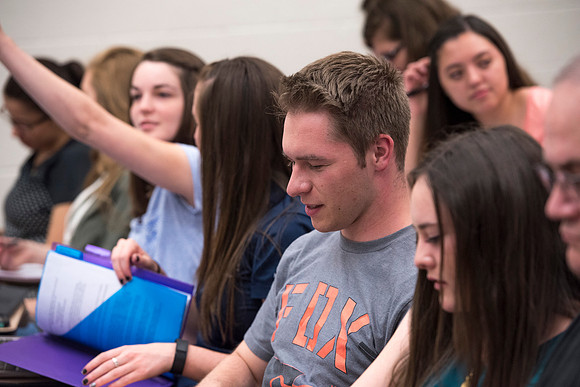 Students working with each other in the Foundations of the Restoration course on campus.