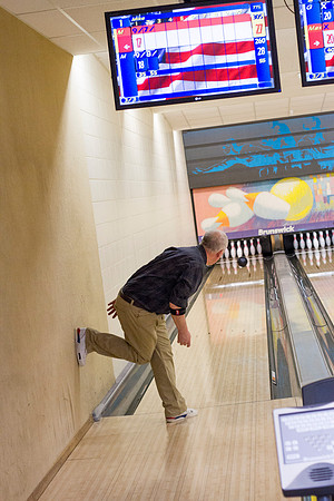 Mike Lewis looks for the strike during a faculty bowling competition.