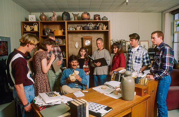 Art teacher, Matt Geddes, surrounded by his art students.