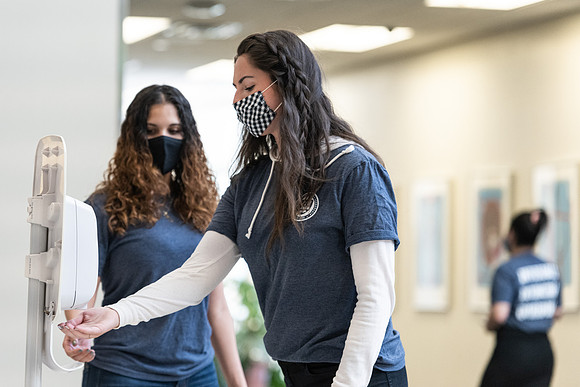 Students use hand sanitizer on campus to stay safe and healthy.
