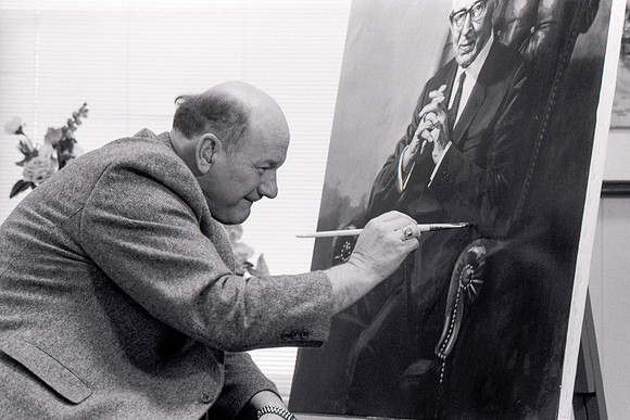 Dick Bird restoring painting of President Joseph Fielding Smith.
