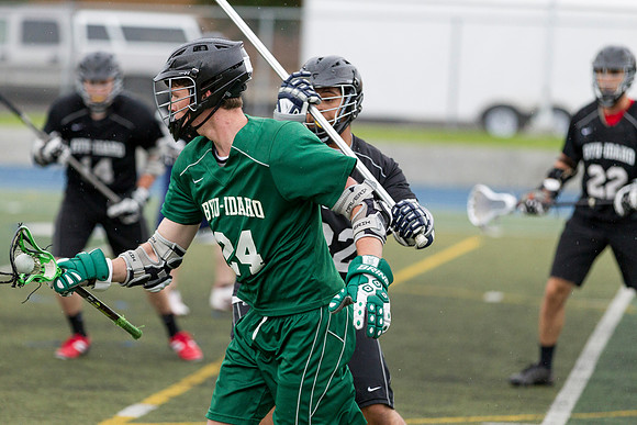 Spartan's Kevin Bosley swim dodges past a Knight defender.
