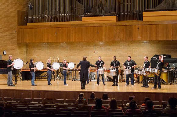 Students playing drums at the RixStix concert, Spring 2013